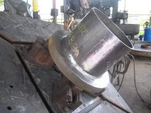 16 AWWA Class E Skirt Flange being welded in the positioner